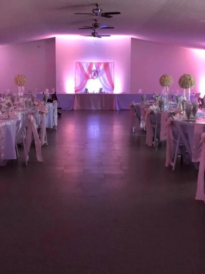 Reception with pink uplighting